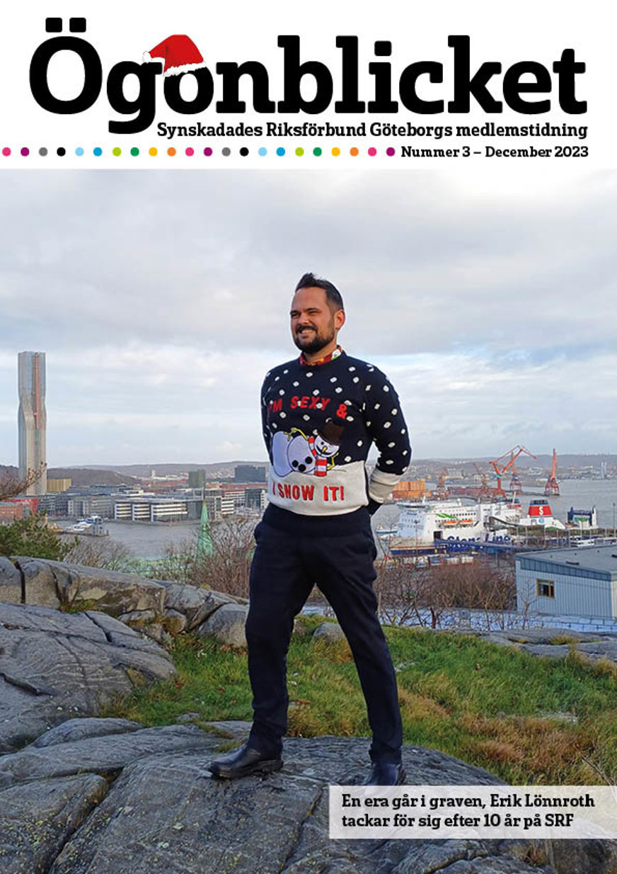 Framsidan av Ögonblicket nr 3 2023. Erik Lönnroth med jultröja med snögubbe där det står "I'm sexy and I snow it" på. I bakgrunden syns Karlatornet och Göteborgs hamn.